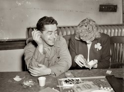 March 1944, Washington labor canteen. Socializing with a hostess at the St. Patrick's dance. View full size. Medium format negative by Joseph Horne.