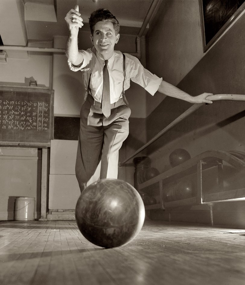 March 1944. "Thomas Gilmartin bowling at the Lighthouse, an institution for the blind at 111 East 59th Street in New York. Rail on his left is a guide to the starting line." View full size. Medium-format safety negative by Richard Boyer.
