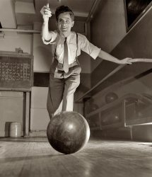 March 1944. "Thomas Gilmartin bowling at the Lighthouse, an institution for the blind at 111 East 59th Street in New York. Rail on his left is a guide to the starting line." View full size. Medium-format safety negative by Richard Boyer.
