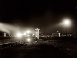 December 1942. "Chicago, Illinois. Work goes on twenty-four hours a day at this Chicago and North Western Railroad yard." View full size. Medium format negative by Jack Delano for the Office of War Information.