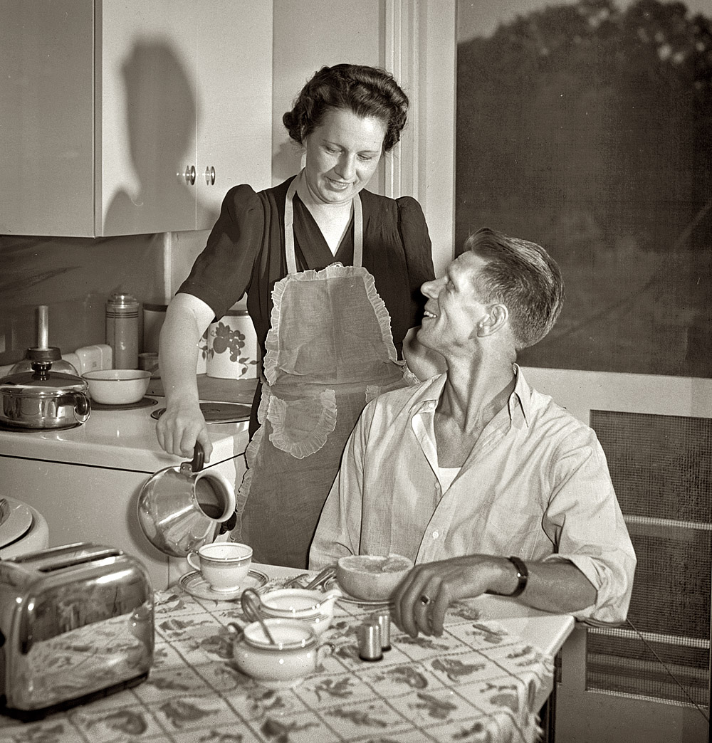 June 1942. Sheffield, Alabama. "Mrs. Hall prepares breakfast for her husband, Kenneth, before he leaves for work at the aluminum plant." View full size. Medium format negative by Arthur Rothstein for the Office of War Information.