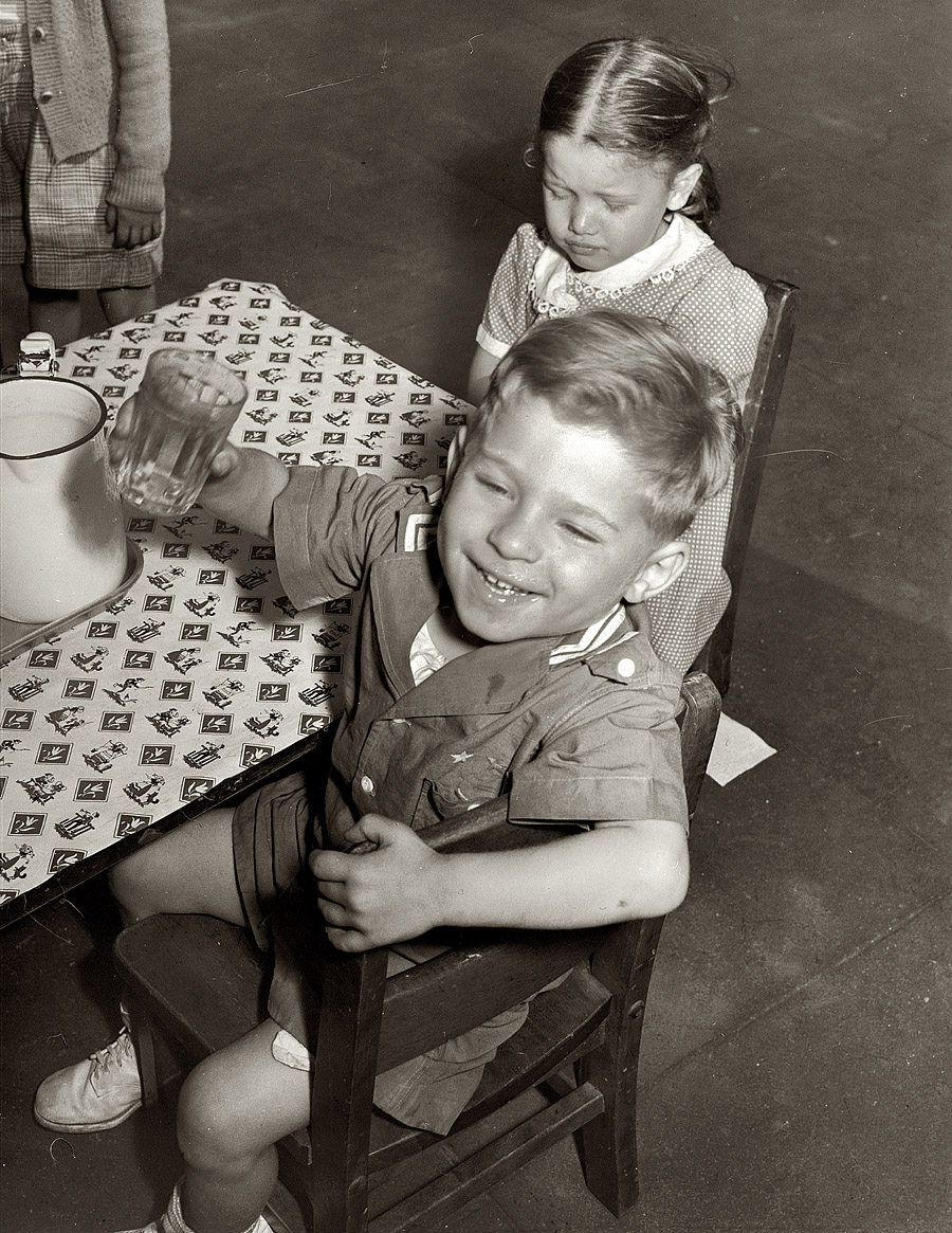June 1942. "Queens, New York. Children get milk or tomato juice after their nap at the nursery school at Queensbridge housing project." View full size. Medium format negative by Arthur Rothstein for the Office of War Information.