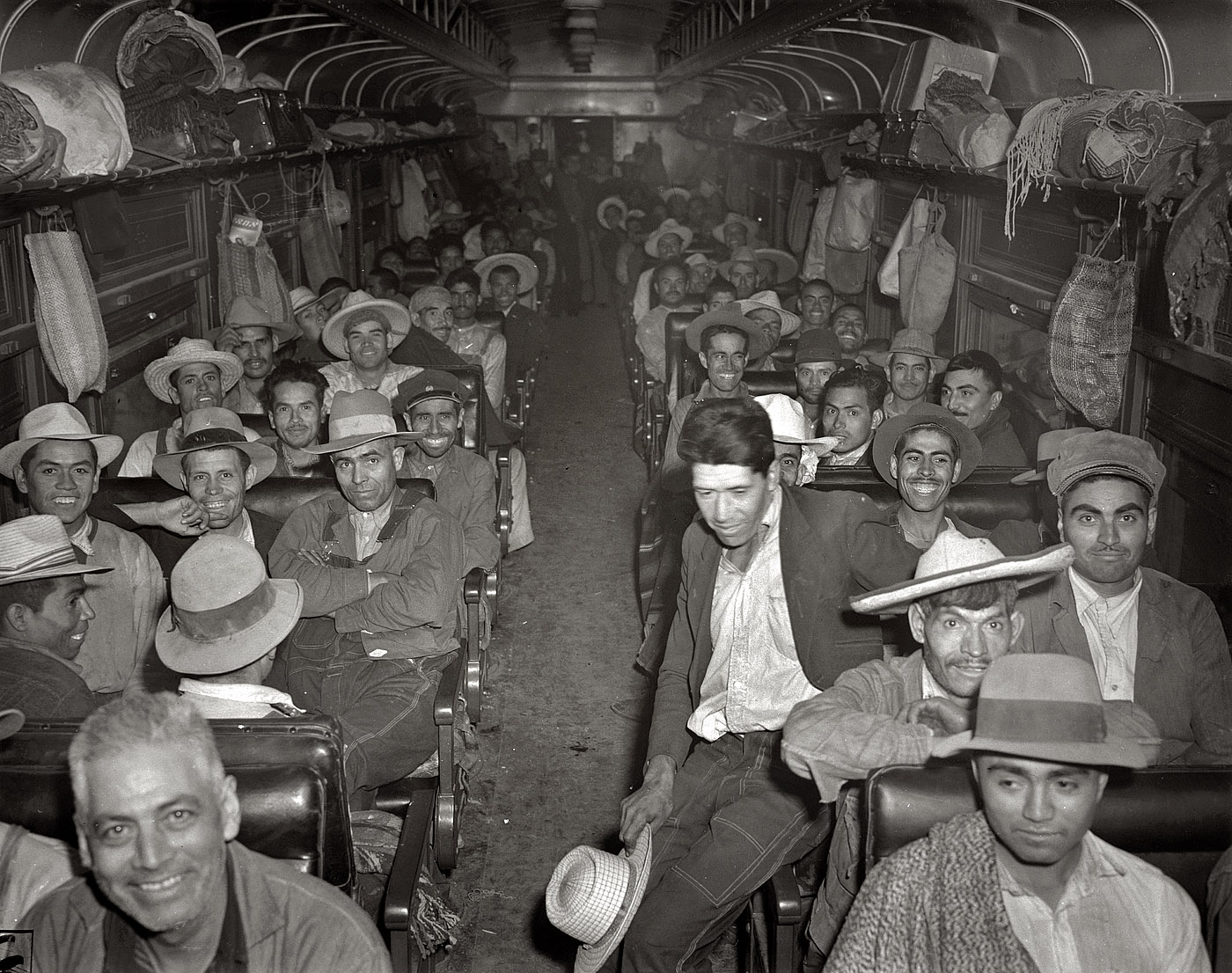 May 1943. More Mexican sugar-beet pickers headed north. "Mexican workers recruited and brought to the Arkansas valley, Colorado, Nebraska and Minnesota by the FSA to harvest sugar beets." View full size. Office of War Information.