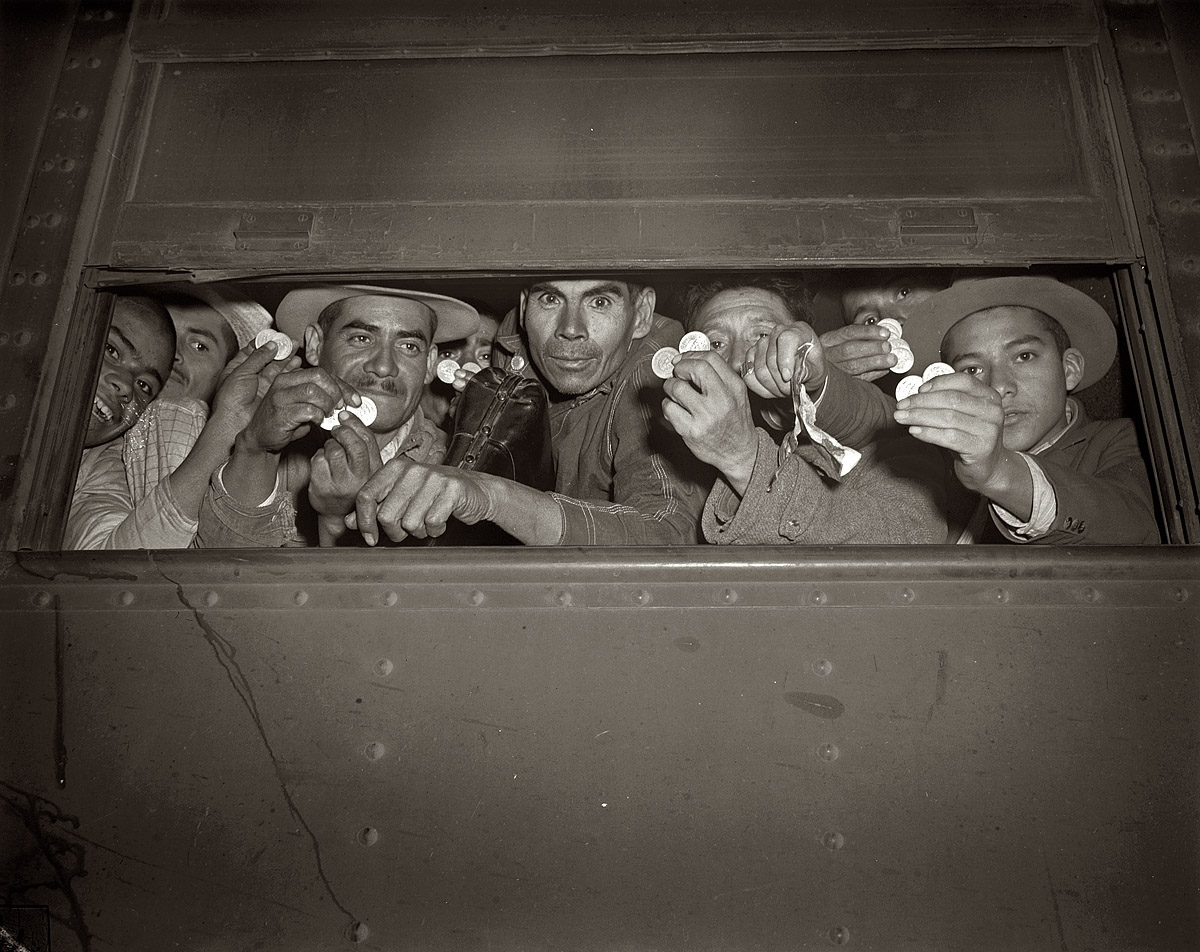 May 1943. Peso-brandishing beet harvesters brought north from Mexico by the Farm Security Administration during World War 2. View full size. OWI photo.