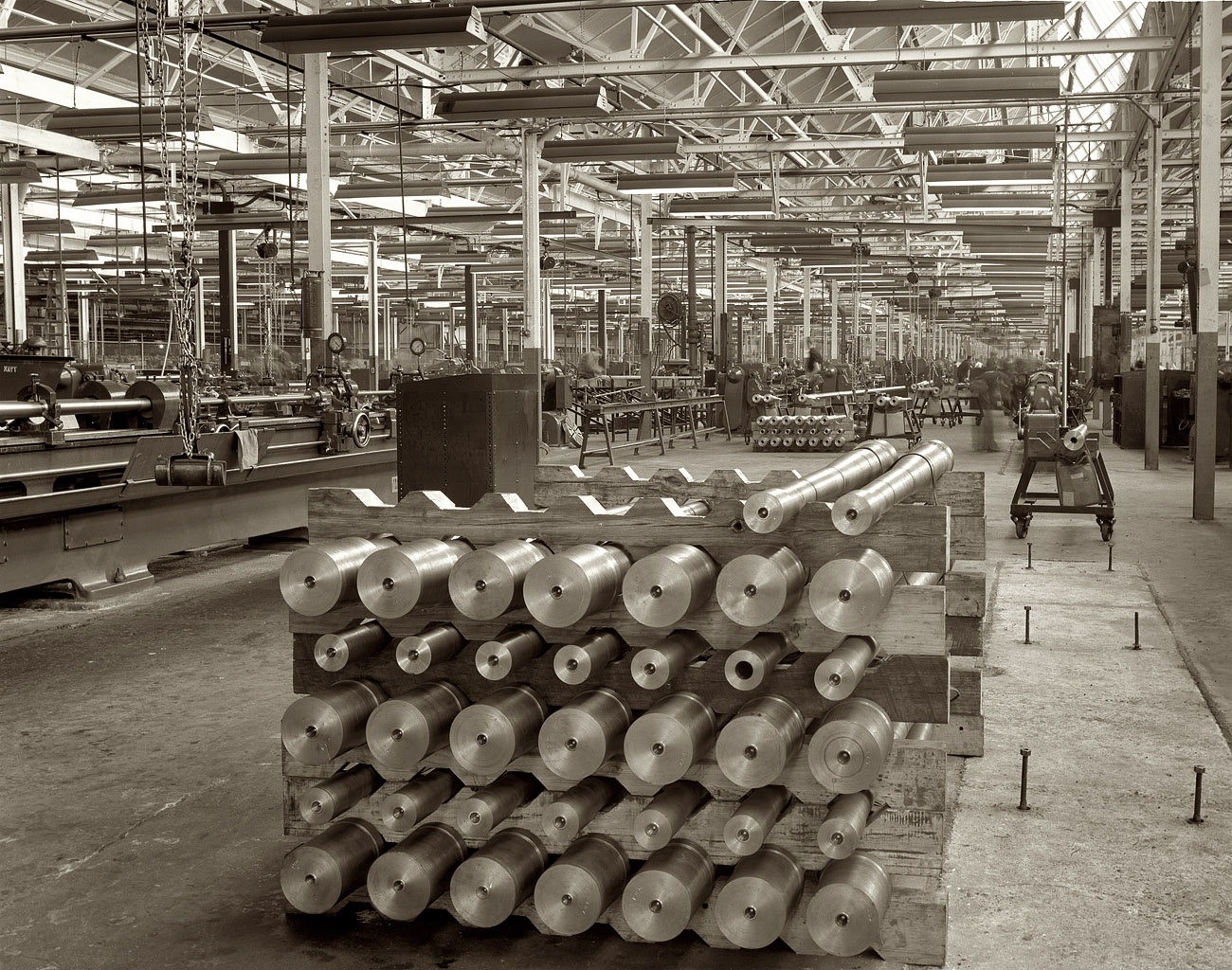1942. Chrysler Corporation plant at Highland Park, Detroit. "Conversion. Here, in a former automobile plant, 40 mm. anti-aircraft gun barrels are machined and made ready for front-line duty. Since they must shoot fast-moving objects at great distances, they must be finished to the very finest of tolerances." Medium format negative by Alfred Palmer for the Office of War Information. View full size.