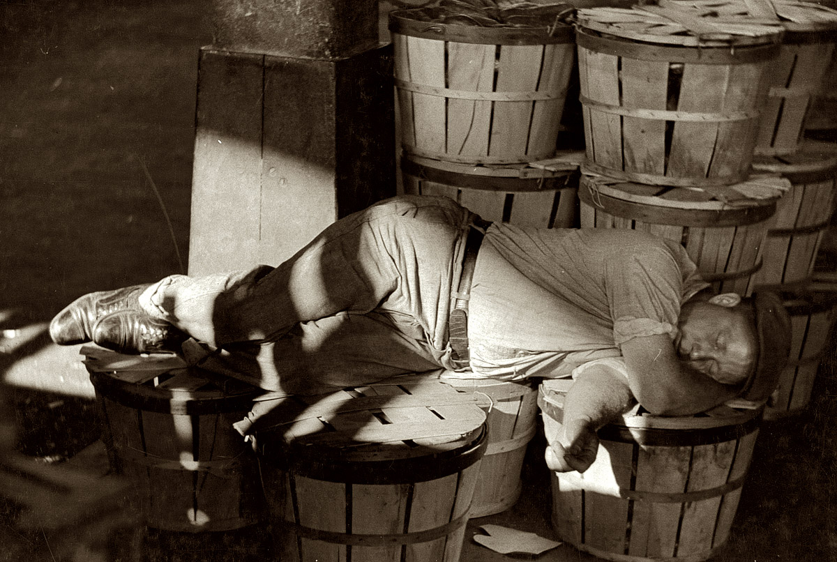 July 1938. "Man sleeping in the Baltimore fish market." 35mm nitrate negative by Sheldon Dick for the Farm Security Administration. View full size.