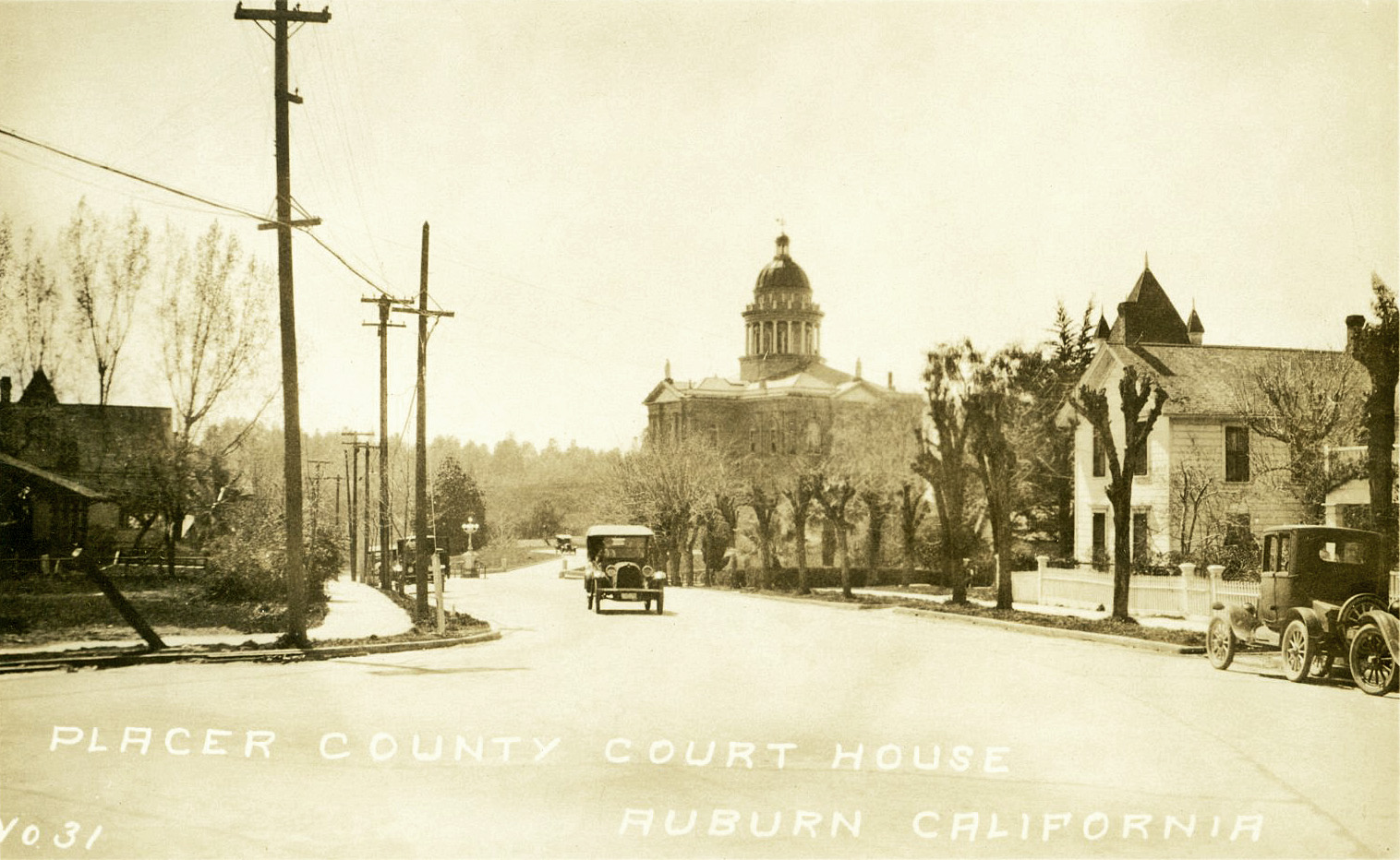 This is a photograph of the Placer County Courthouse looking down what is now Lincoln Way in Auburn, California.  This photograph, which is in our collection (Placer County Museums), did not have a date.  We have an estimated date range of late teens to early twenties, but I am hoping an auto enthusiast out there can help us narrow this somewhat. View full size.