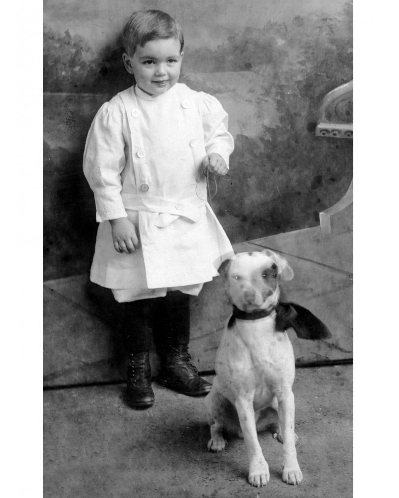 Although he passed away in 2000, June 30, 2009, is my late father's 100th birthday. This studio portrait of him and his dog Clover was taken in 1912. He was born in the little logging town of Clatskanie, Oregon, and seems to have inherited his father's innate love of and deep abilities with dogs and horses, even though his dad died only shortly after this photo was taken, from an injury suffered in a logging accident. I've been thinking about sharing some of my old family photos with Shorpy viewers for a long time, and my dad's centenary finally got me going.
