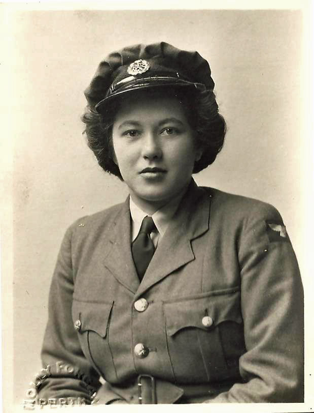 This was taken sometime during or Just before World War Two in England. Elizabeth served in the RAF as a member of the Women's Auxiliary Air Force (WAAF) Service. She was an extremely intelligent young lady as she worked in a Secure Communications Unit. Do research on Bletchley Park. Her eyes tell the story.    
