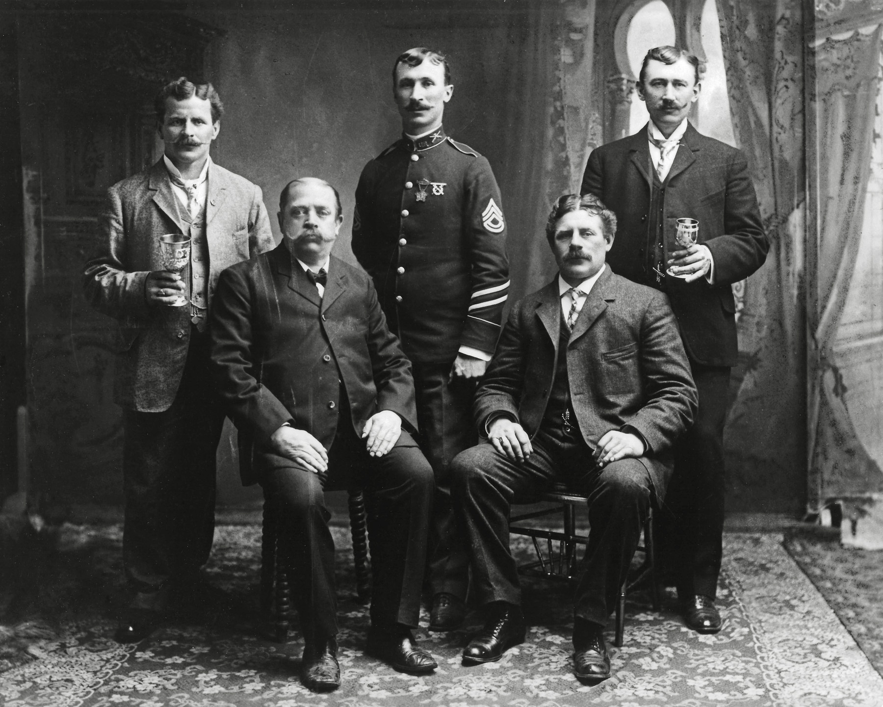 My paternal grandfather, Josef Alois Kappeler, upper right, (born in Switzerland in 1864) and his brother, August, a member of TR's Rough Riders, in uniform and 3 men who appear to be related. I believe they were members of a choral society.  Wish I knew more. View full size.