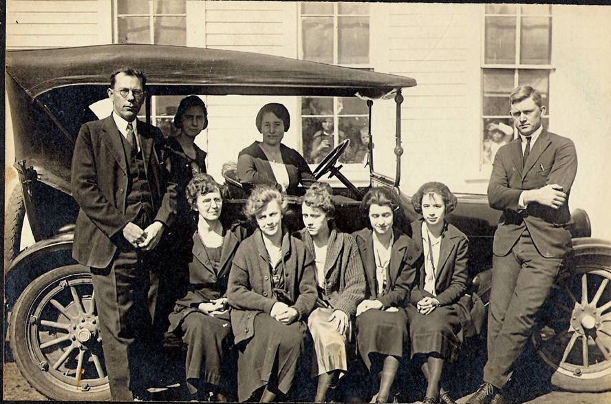 My great-great grandfather Ancil West (standing at left). Among the many things he did during his lifetime, he was principal of a small school in Stockdale, Texas. Here he is with his teachers. My favorite part is the kids peeking out of the windows in the background.