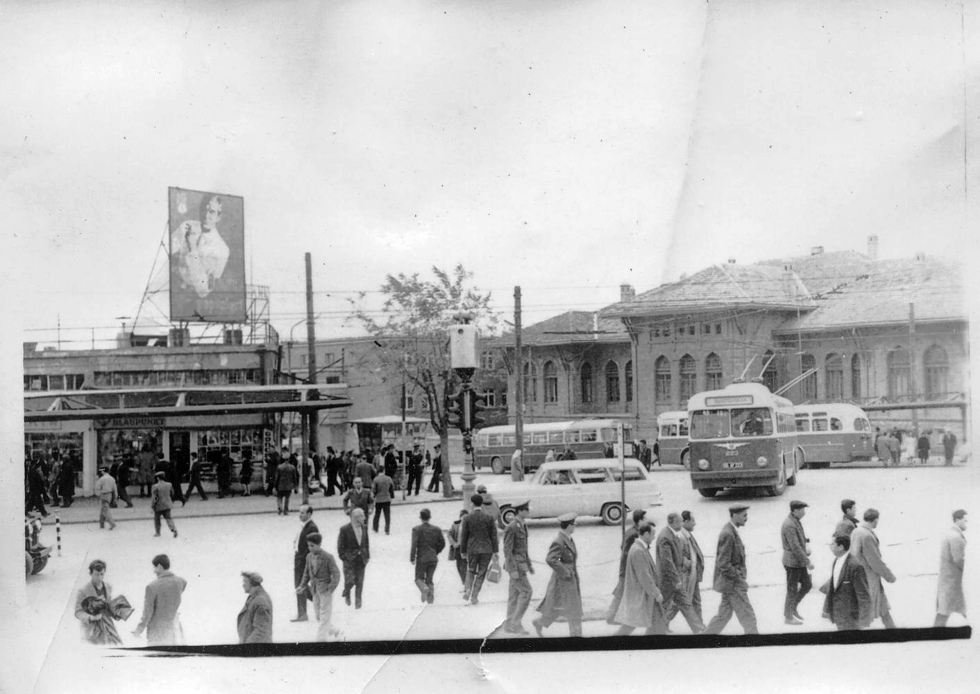 Another photo taken in Turkey 1963 when my dad was stationed there. I am thinking the billboard has to do with the 40th Annivesary of the founding of the modern country related to my previous posting. Though it seems like only men are allowed to mill around town. View full size.