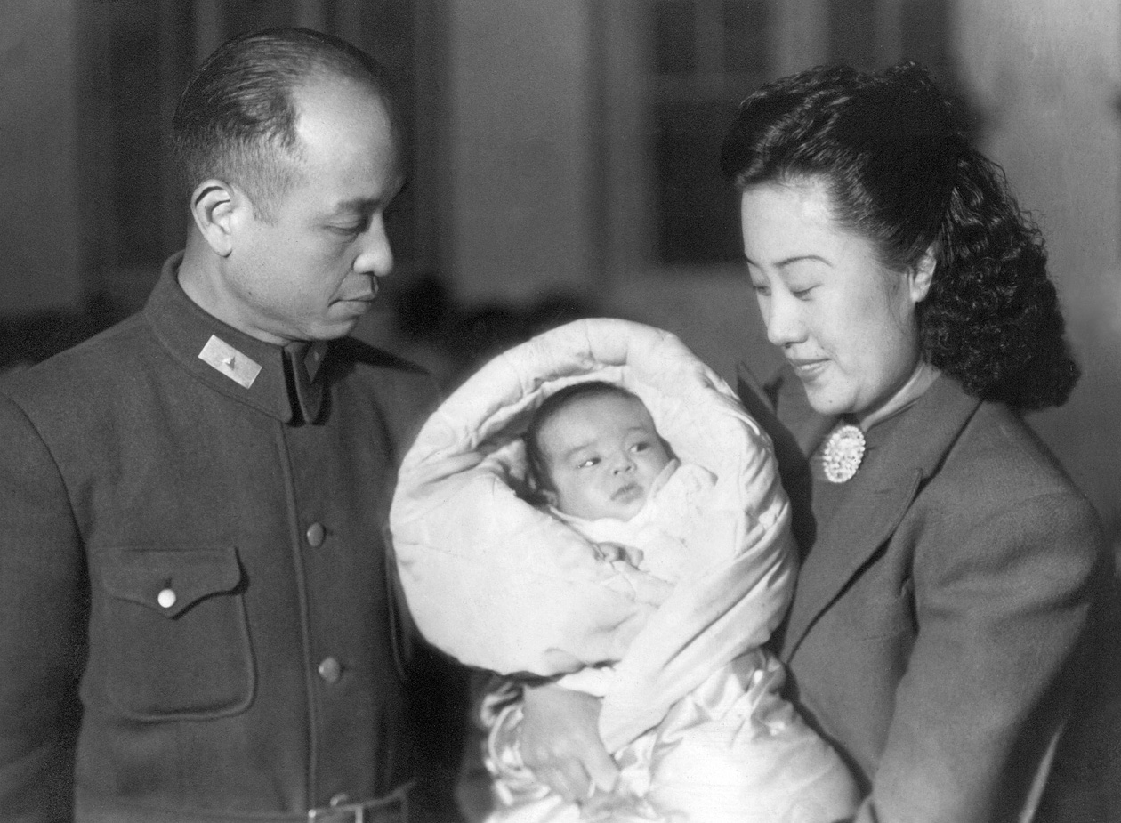 We think this is a portrait our great aunt and uncle during WW2/Sino-Japanese War and the Chinese Civil War.  We don't know the city or any circumstances.  The lady was my grandmother's sister.  At this time we think they lived in Beijing.  We also are debating the rank insignia: the lack of contrast between the triangle on the collar and the field color of the insignia makes me think it might be Maj. General in the Chinese National Revolutionary Army (Chiang Kai Shek). This would fit other photos of him where he appears to be wearing bars for Colonel.  Of course, in black and white it is hard to tell and for all I know it could be private.  Many of our photos show the couple mingling with US Army staff, which is in keeping with the fact that our grandfather was assigned to General Marshall's Peace HQ in China.  We have more questions than answers, unfortunately. View full size.