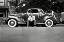 My dad took this in the late 1930's either in Detroit or Dearborn, Michigan.  I think the guy is my dad's cousin.  No idea what kind of car. View full size.
The Most Beautiful Thing on Wheels...or so Pontiac heralded their 1935 Models in print ads. It marked the first year of their trademark "Silver Streak," and featured the new solid steel "turret-top." 1935 was the only year Pontiac produced cars with the grimly nicknamed "suicide doors" in front. This particular "Beautiful Thing" is a six-cylinder coupe from that year.
Here is a page from the 1935 Pontiac sales brochure:   
(ShorpyBlog, Member Gallery)