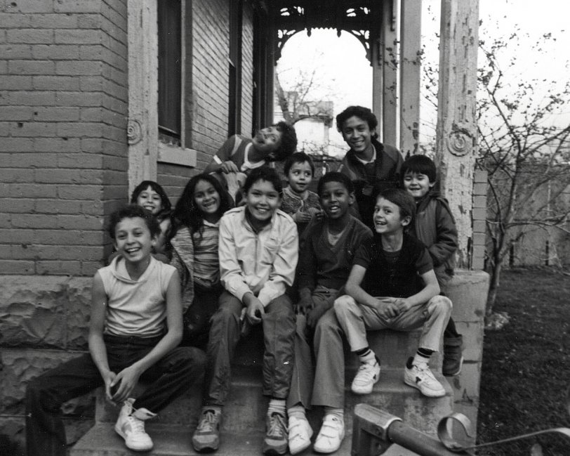 Many of the Arroyo grandchildren taken on the front steps of the family home on Curtis Street in Denver, Colorado, 1980 by James Arroyo.  These children are descendants from the original Hispanic settlers in Colorado and New Mexico. View full size.
