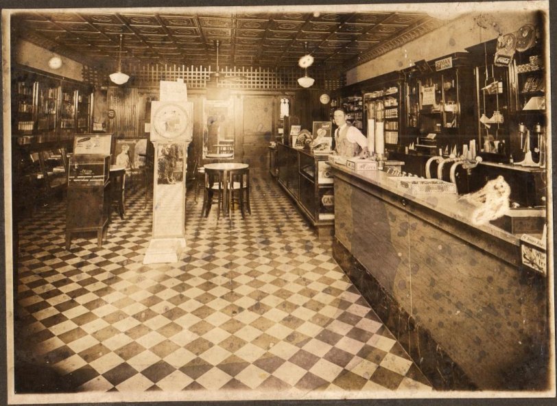 My grandparents bought this drugstore in 1957 from Mr. Adams (pictured). The back of the photograph reads: We're unsure- but this may have been Adams Drug Co in the 30's, 40's? We bought it in 1957 and fixtures like these + the tin ceiling were in it then. Ralph + Daphne Ashworth July 1997
My grandfather still works here, along with my uncle who now runs the business. My father, brother, and myself work upstairs of the drugstore (former Mason Lodge) running a chain of retail stores.
Location: Ashworth Drugs 105 W. Chatham St. Cary, NC 27511
