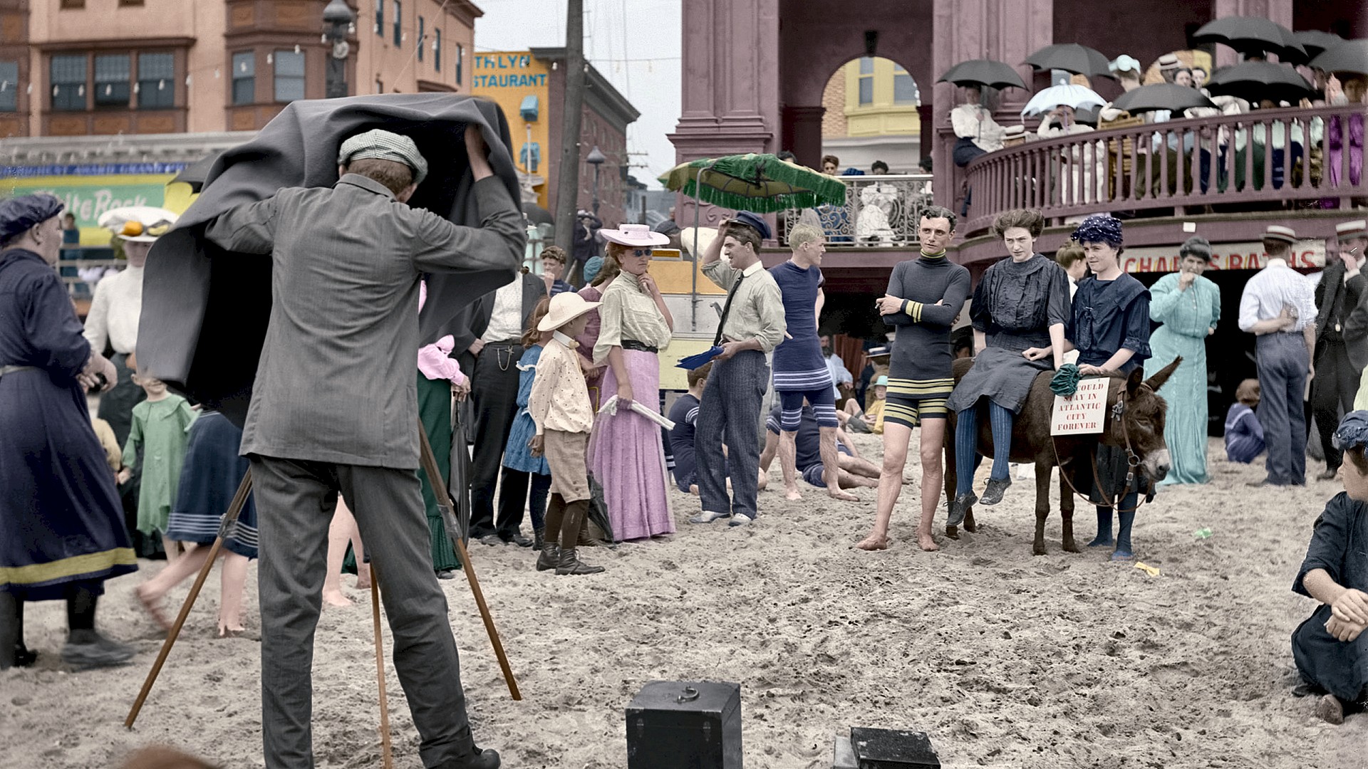 Yet another in my string of Atlantic City colorizations, this one taken in front of Richard's Baths. The original b&w is here. 

I went looking to see if I could find any information about the historical color of Richard's Baths.  I found a newsletter which references this very photograph, and mentions that Richard's Baths were a dark maroon color.  The purply color I came up with after much experimentation was the best I could approximate it.  

The newsletter is available as a pdf file.

This photo only took about ten hours to colorize, which means I'm getting better! View full size.