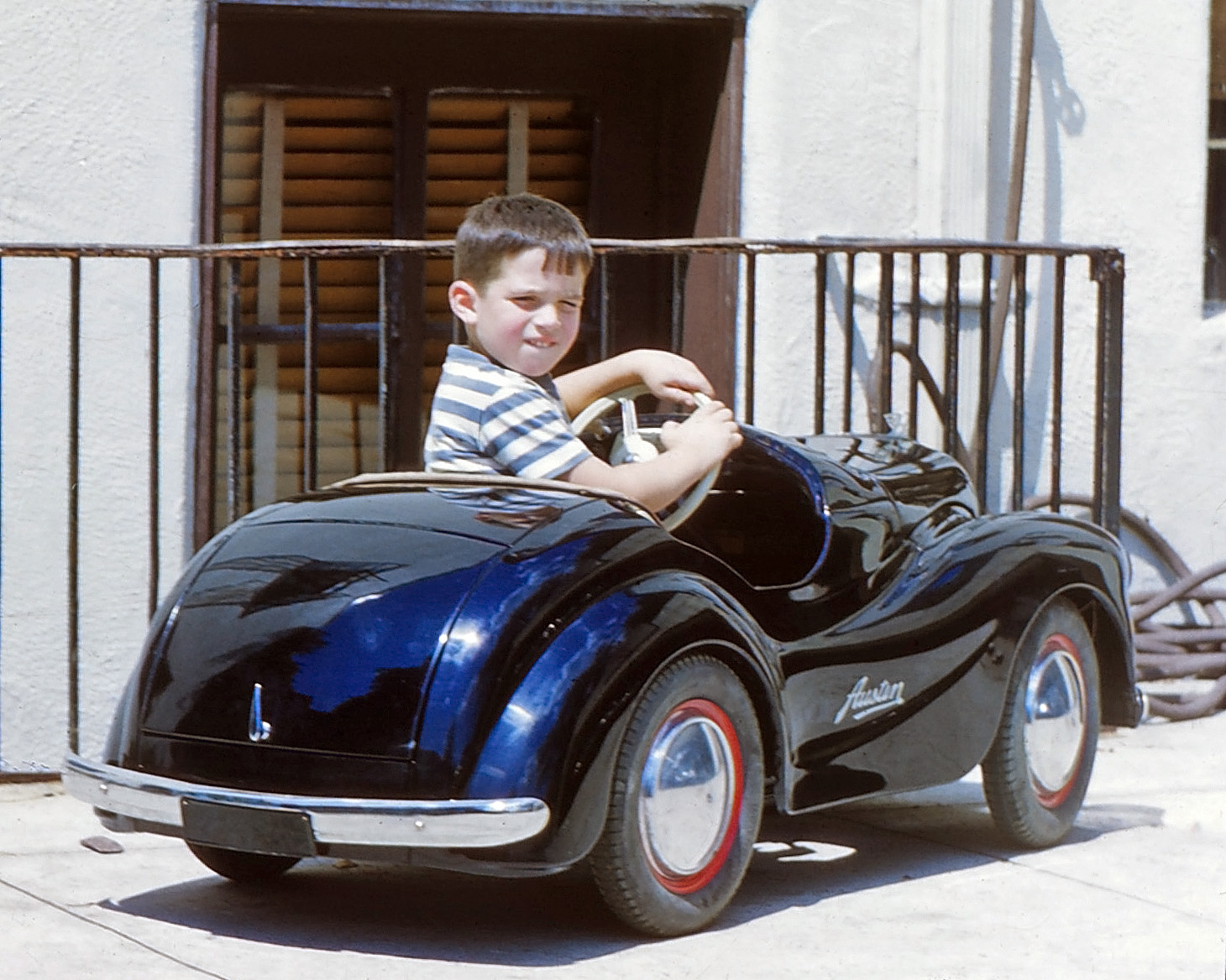 Young motorist in an Austin pedal car circa 1949. From a set of 35mm Kodachromes I acquired in northern New Jersey. Here is another view. View full size.