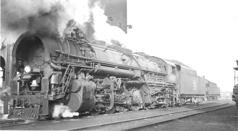 B&M 4000, T1a class 2-8-4 smoking it up on the ready track in Boston circa 1930.  Built by Lima Locomotive Works, Lima, Ohio in 1928.  Considered ugly by most railfans due to the "Cobra Hood" Coffin feedwater heater mounted on the front of the boiler.  Photographer unknown. View full size.