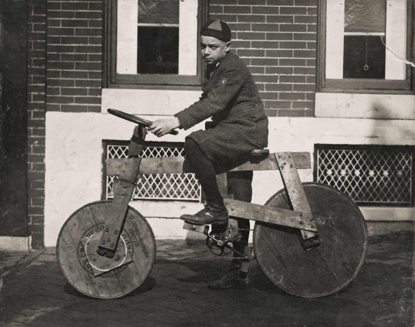 Bernard J. "Boompy" Logue of 2527 E. Monument St. in Baltimore, MD, about 1920, on his home made bicycle. View full size.
