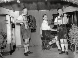 Frank Anneser (left) and friends decked out in lederhosen with their German Oktoberfest band.  Bringing a taste of Bavarian music to Buffalo, New York, in 1925.  View full size.  