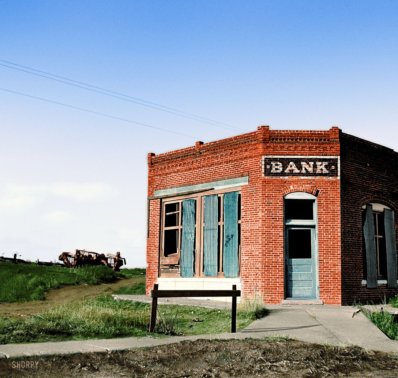 May 1936. "Bank that failed. Kansas." Medium-format nitrate negative by Arthur Rothstein. I decided to colorize this photo. I think in color it looks better. View full size.