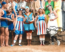 Colorized version of Bathing Beach Parade, 1919. View full size.
LibertyI'm pretty sure that Gibbs as Liberty is the first from the left - the headwear I think is a representation of the statue's.
Not sure what the two on the far left have come as :)
Patriotic FootwearLove the Shoes &amp; Socks!
In the photo (left-to-right): Dot Buckley, Audrey O'Connor (holding silver loving cup for "Washington's most beautiful girl in a bathing suit"), Muriel Gibbs, and  Grace Fleishman (holding silver loving cup for "First prize in the costume contest"). Or perhaps the order is Gibbs, O'Connor, Buckley and Fleishman.  The press description of the girls outfits is below.  What do you think?




Washington Post, Jul 27, 1919.


  Galaxy of Beauty Parades at the Beach.

    Comely Damsels in Scant Attire Win Prizes for Their Appearance.


    While more than 5,000 persons clambered to each other's shoulders and to the roofs of nearby buildings to view the Annette Kellermanns at the first annual beach parade at the Tidal basin yesterday afternoon. Mrs. Audrey O'Connor, 620 Maryland Avenue southwest, was proclaimed by the judges as Washington's most beautiful girl in a bathing suit. Mrs. O'Conner wore a blue and orange jumper, blue cap and orange tights. Miss Dot Buckley, 1250 Tenth street northwest, received honorable mention in the contest. her suit was a creation in red, white and blue.
    First prize in the costume contest was awarded to Mrs. Grace Fleishman, 5 Iowa circle, who wore a white silk suit, with black and white border and a white silk hat. Miss Muriel Gibbs, costumed as Miss Liberty in stars and stripes, received honorable mention. Silver loving cups were awarded to the winners of both the beauty and costume contests.
    Following the parade of the score or more of the beauties between the cheering crowds of bathing beach fans, the former faced half a dozen movie machines and a battery of press cameras. Later one of the winners obligingly did a modified "shimmy dance" for the movie men.

Outstanding!This is really outstanding. I'm usually not one for colorizing (because of the skin tones) but this is really exceptional. Skin tones look beautiful, hair has highlights and the colors are vibrant! Outstanding work! Bravo!
Audrey O&#039;ConnorWhile colorized version is nicely done, Audrey's loving cup is actually copper, not silver.  Audrey is my paternal grandmother.
(Colorized Photos)