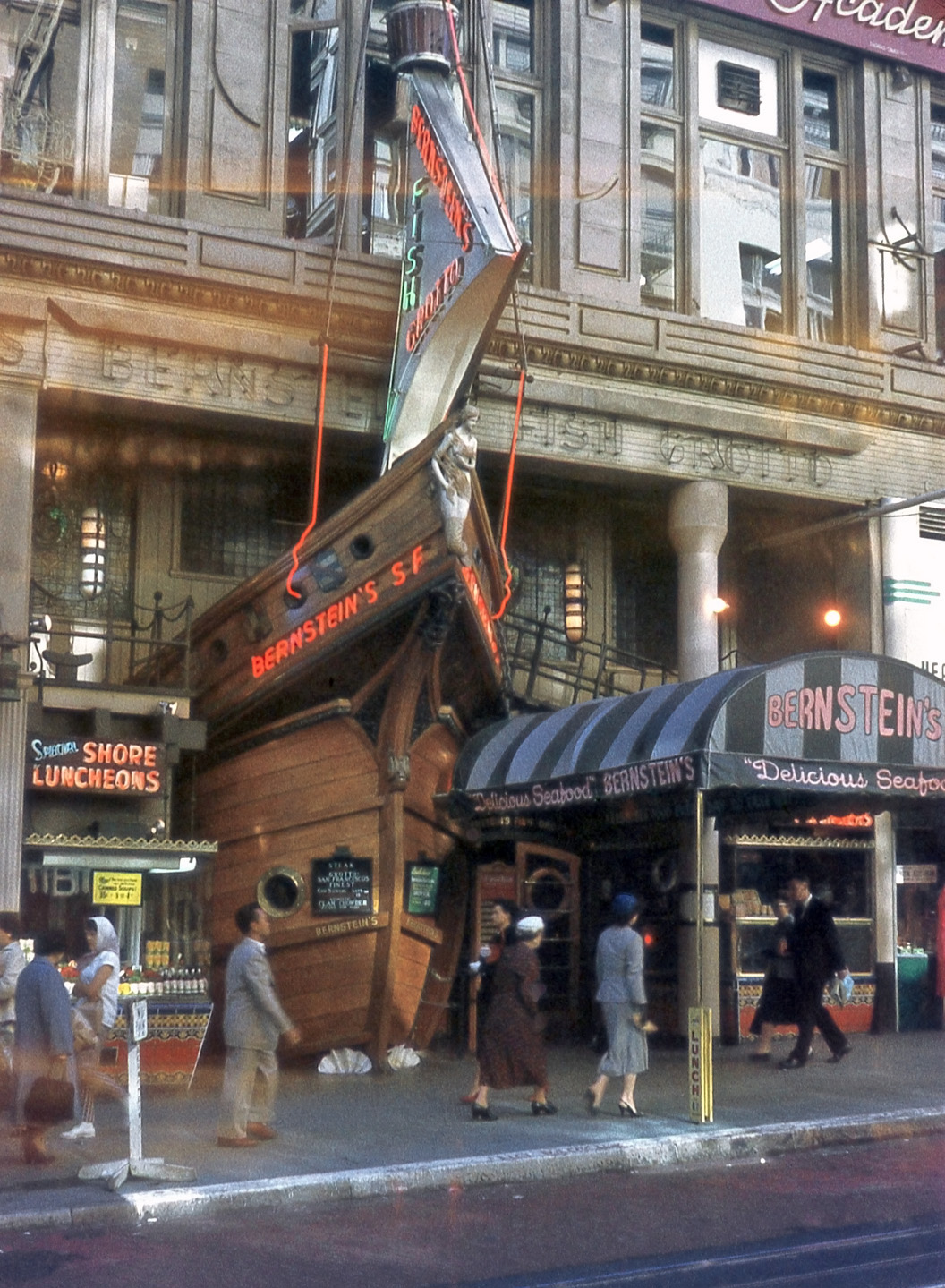 Bernstein's Fish Grotto restaurant on Powell Street in San Francisco in 1957. I like the building facade; when someone said "take a bow," Bernstein's took it literally! Color slide by my father. View full size.