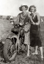 Sisters Bertha (my grandmother) and Esther Phillips posing with a motorcycle in the fields of Nebraska. Taken between 1925 and 1935.