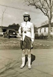 Mom, clarinet in hand, wearing the uniform of the Mary Washington College band. Her father also played, among other instruments, the clarinet. View full size
(ShorpyBlog, Member Gallery)