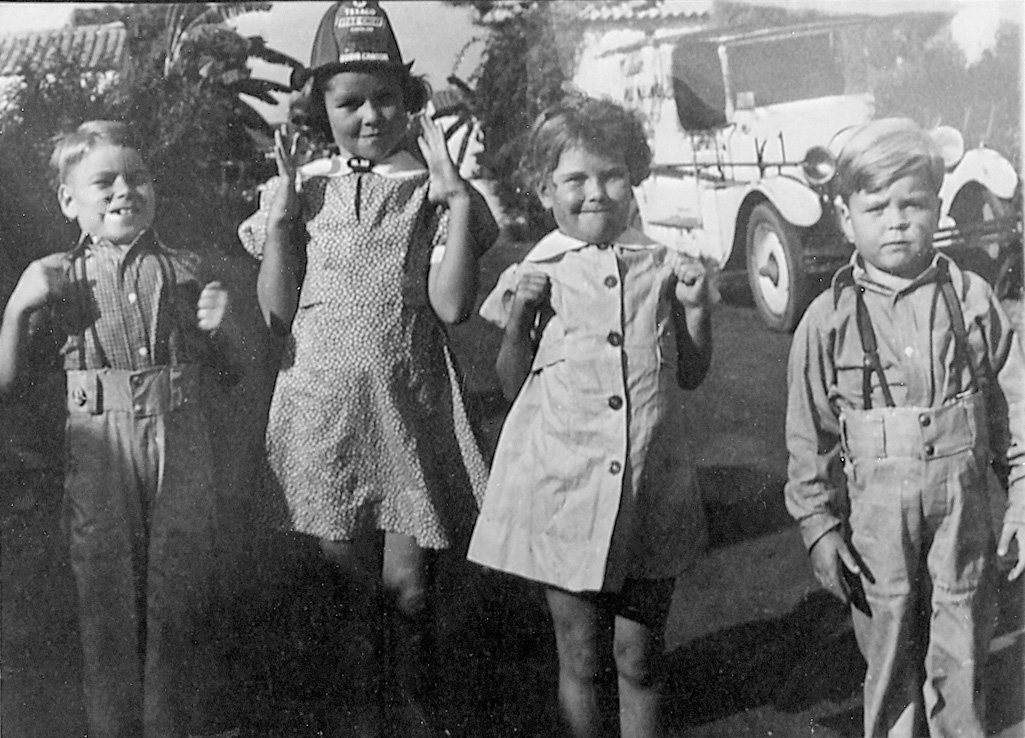 The kid on the right is me, Dick. I'm upset because my sister got to wear the fireman's hat. This was taken in Los Angeles. View full size.