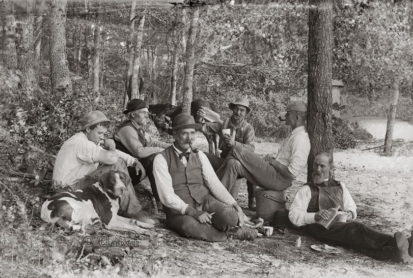 I don’t know anything about these guys but I’d love to join them and their dog for a few shots.  Scanned from the original 5x7 glass negative. View full size.
