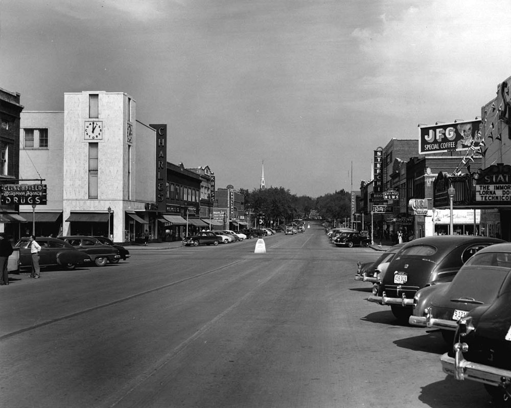 Kingsport, Tennessee, 1952.  Broad St. at Center St. intersection, the main north-south/east-west intersection of the downtown business section.  Broad St. was a perfect cruising street, a traffic circle on the north end and a U-turn arc on the south end at the depot.  Four wide lanes for traffic and the businesses, except for news stands and theaters, closed by 6 pm.  Photographer, Thomas McNeer, Jr. View full size.
