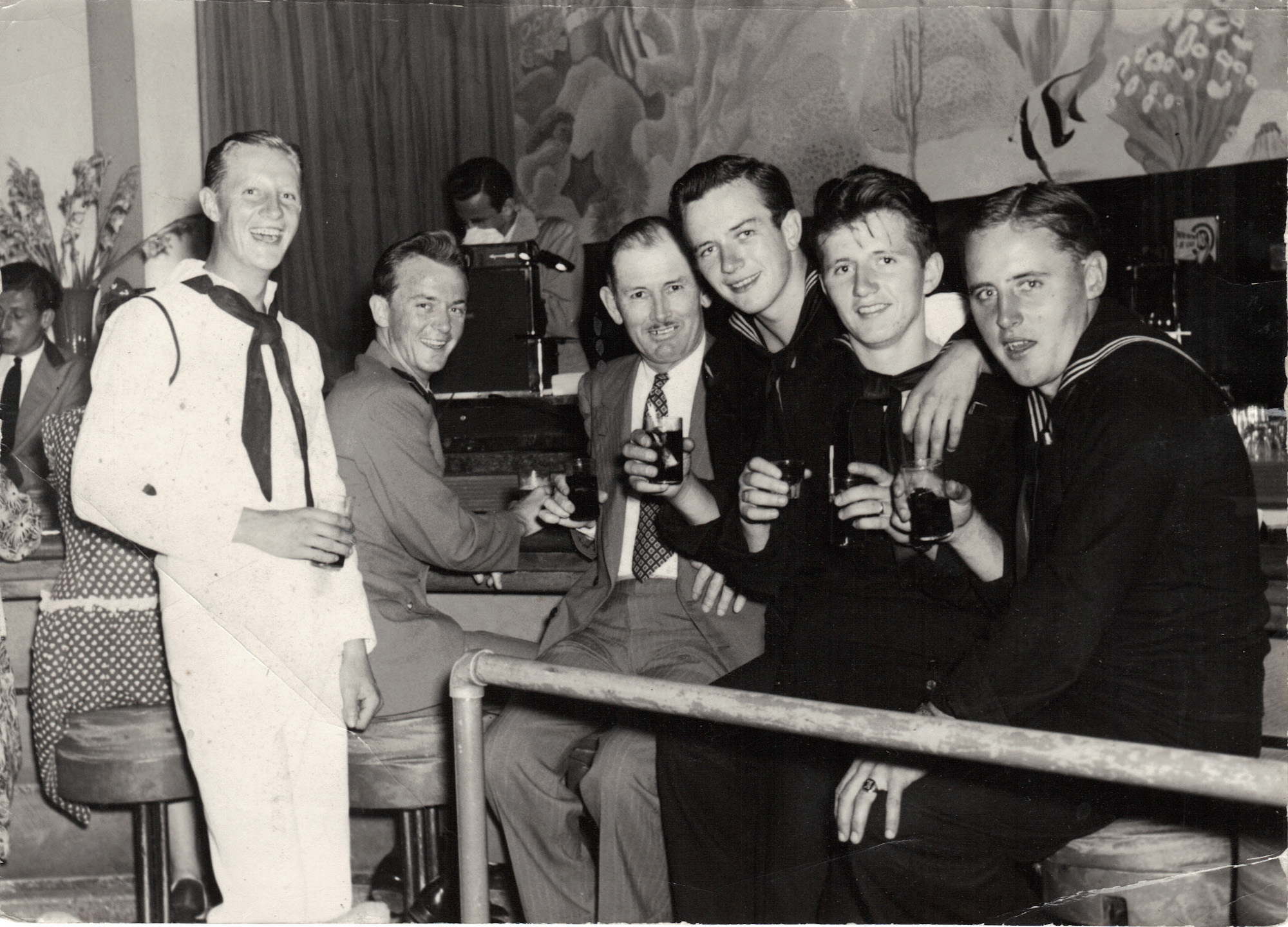 My father (on left) at some club in Florida before shipping out to the Pacific during WWII. He was on the USS Allentown. View full size.