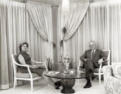 1967. Susie and Oliver Baugher relaxing in their Waynesboro, Virginia, home. Their house was genuine mid-century modern but their style and grace were from another era. The perfect hosts, they always made you feel good about yourself (style and grace Rule 1). Susie lived to be 100. View full size.
I knew Mr. BaugherIs this gentleman also known as Claude Baugher, the Chevrolet dealer? Everybody called him "CO". Maybe Oliver was his brother? I knew C.O. in the mid to late 60's and visited in Waynesboro. C.O. collected early Virginia license plates and had them plastered all over the exterior of a 1967 Chevy in order to attract attention to his hobby (which I shared, and still do). It probably also sold a car or two! 
Reading material:House Beautiful ("1001 Drapery Ideas").
Yes, one and the same.It's great to see your comment. Friends and people in the business called him C.O. I remember the Chevy that was completely covered in license plates. And yes, it was probably another one of his marketing tools that led to a sale!
(ShorpyBlog, Member Gallery)