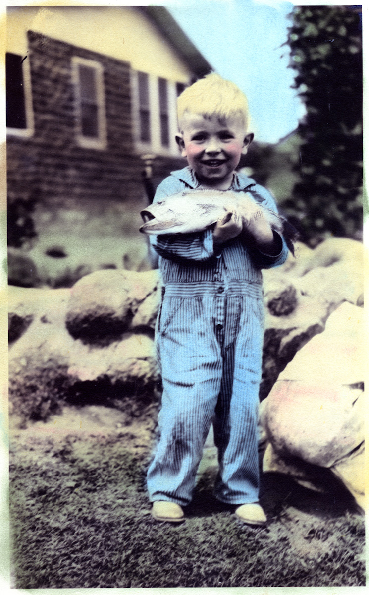 I am not sure of the story behind this photo, but my father, Dr. Charles Bondurant, was about 3 or 4 at the time.  I am guessing that it was taken in Oklahoma around 1932 or 1933. I am also not certain who did the hand-coloring. As the fish is a Striped Bass, I would guess that it was caught in Lake Texhoma on the Oklahoma-Texas Border. View full size.