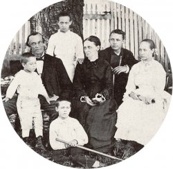 This is the family of my maternal great grandparents, Charles Frederick Weigandt Sr., a well-known portrait artist and his wife, Emma L'Hommedieu Weigandt. They were married in Jackson, Mississippi in July 1860. The oldest boy, Carl (Charles Jr.) was born in Jackson in June 1861, two months after the start of the Civil War. The family moved to Athens, Georgia and the two girls were born there: my great Aunt Kate in 1863 and my grandmother, Mary Anna (standing against the tree) in September of 1865. The war ended on April 9, 1865 and as soon as they could, they traveled north to Baltimore in Maryland. William was born there in 1869 and John, the youngest, was born in 1873 after they moved again to Westminster, Maryland, just outside Baltimore. The effects of living through those war years shows especially in the faces of the parents and the girls. I often think about what life was like then. View full size.
(ShorpyBlog, Member Gallery)