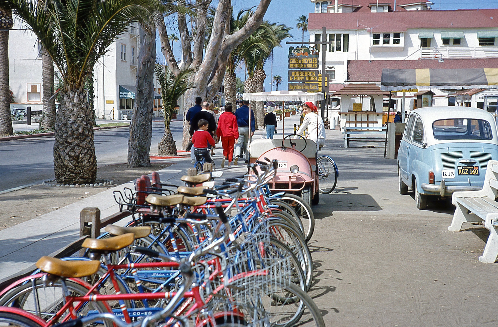 My sister and me, riding away on rental bikes on California's Catalina Island in June 1965. Kodachrome slide by Dad. View full size.