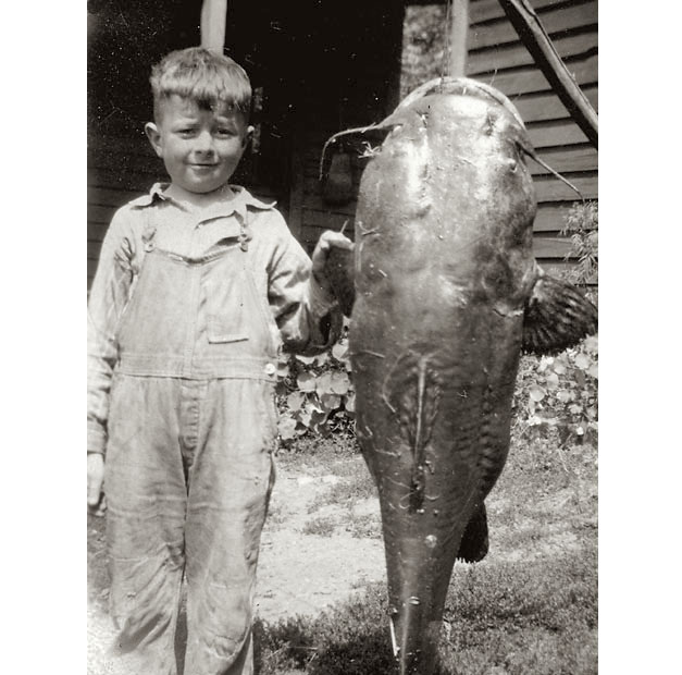 I found this in a box of old family photos. A note on the back of the picture states "Homer Hall and 47-pound catfish caught in Aug 1927." The Hall family (one of whom was married to an aunt of mine) lived in Hudson, Wisconsin, along the Mississippi River, so I imagine that is where the photo was taken. 