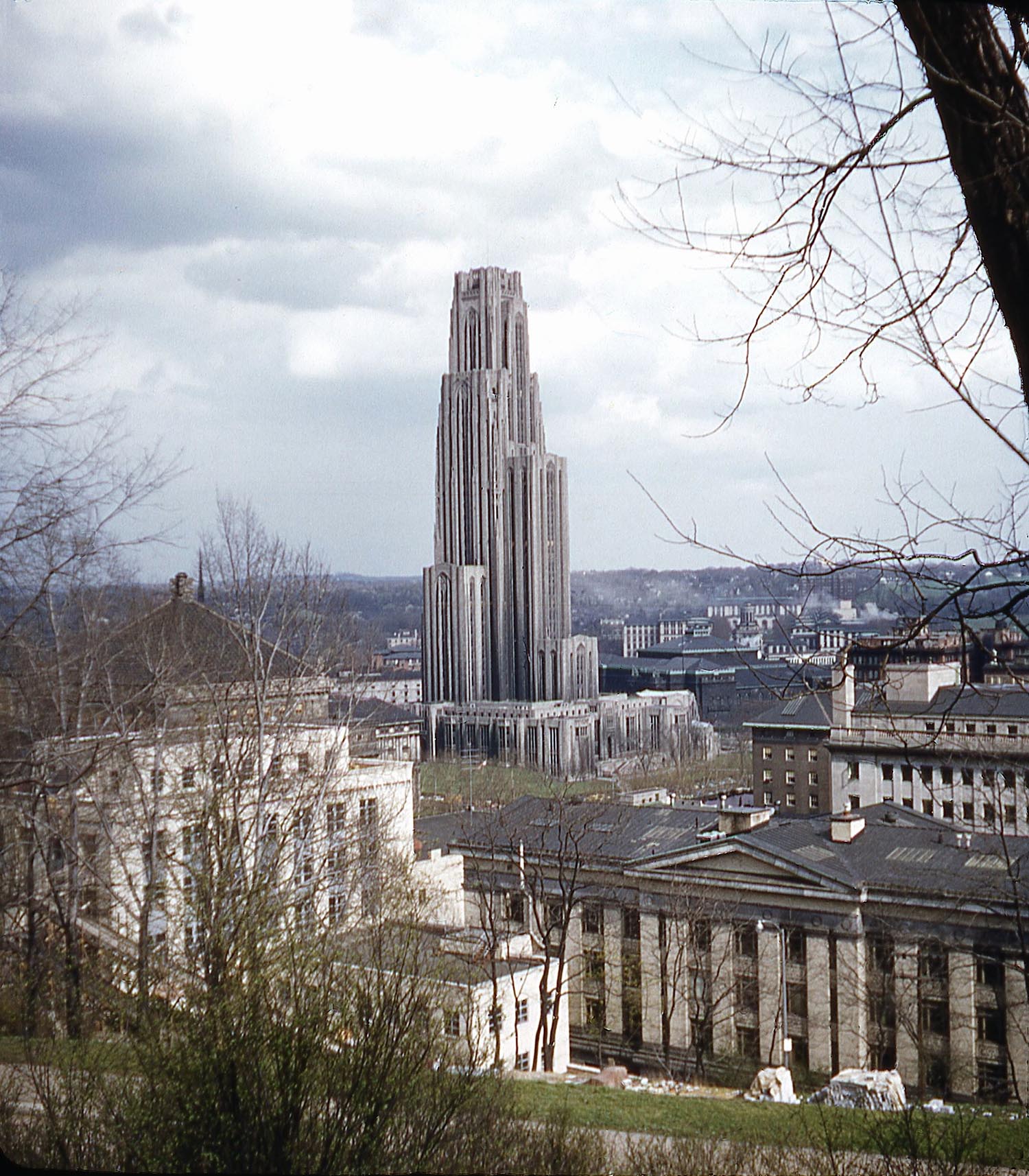 The University of Pittsburgh main campus in Pittsburgh, circa 1948. This is from a scan of a stereo slide taken by my grandfather Ralph E. Archer.  With no information on the slide it took some searching to determine what this structure was and where it was located. It was the most "alien" or out-of-place looking structure I had ever seen both with its unusual design and much greater height (42 stories, 535 feet tall) than everything surrounding it.
 
Known as the Cathedral of Learning this Late Gothic revival is the tallest educational building in the western hemisphere and the second tallest gothic style building in the world.  Commissioned in 1921 and dedicated in 1937 it is a steel frame structure overlain with Indiana limestone and contains more than 2,000 rooms and windows.

During WWII the cathedral was assigned to house, feed and instruct about 1,000 Army Air Corps as well as dozens of Army engineers. As my father, Ralph H. Archer served in the Army Air Corps during WWII this may be the reason for this particular photo in his father's collection and so may date somewhat earlier than 1948.
 
