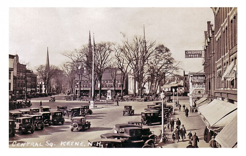 Real Photo Post Card, Azo paper, stamp box design in use 1924-49. Main Street (foreground) was once billed as the "World's Widest Paved Main Street." Congregationalist Church is the white spire at the top of the square, westernmost spire is Grace Methodist, on Court Street. Some version of the Cheshire House, a well-known hotel, stood on the east side of Main from 1837 to 1934, when it was replaced with a one-story commercial block.
