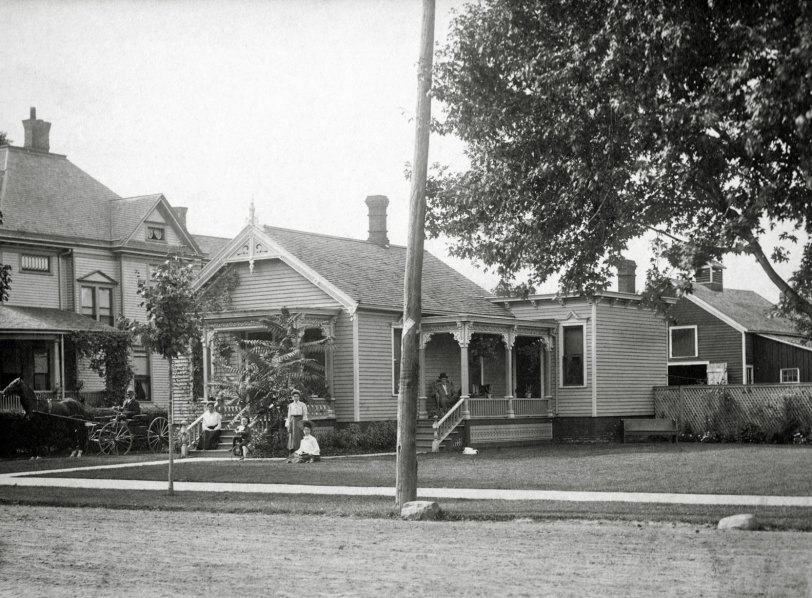 This is our house in Leamington, Ontario, Canada over 100 years ago. I'm not sure who is in the photo nor exactly when it was taken but judging by the family vehicle in the driveway it was a while ago.
My parents lived in this house and I was born in 1944 in Montreal, Quebec as my father was stationed there in the RCAF during WW2. When the war ended we moved back and I lived in this house from 1945 to 1970. My wife and I moved back here in 2009. Over the years there have been changes but the house retains a lot of its old charm. View full size.
