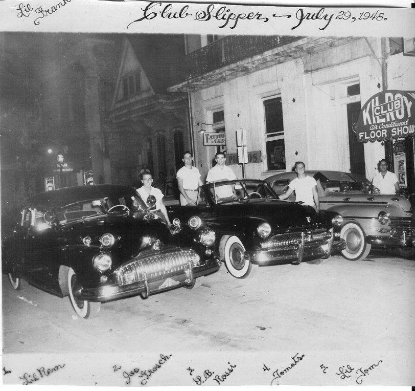 Frankie's friends with their cars in front of the Club Slipper on Bourbon Street, July 29, 1948.  Names of his friends were already on the photograph. He was my first cousin but quite a few years older, I did not know his friends then. This picture is in my possession. View full size.
