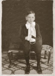 May 1935. Ed Woods in his Our Lady of Lourdes school uniform, West 143rd St. New York City, on Confirmation Day. View full size.
Some things never changeI've got the same "Remind me why I have to dress up again?" face in all my Confirmation photos.
(ShorpyBlog, Member Gallery)