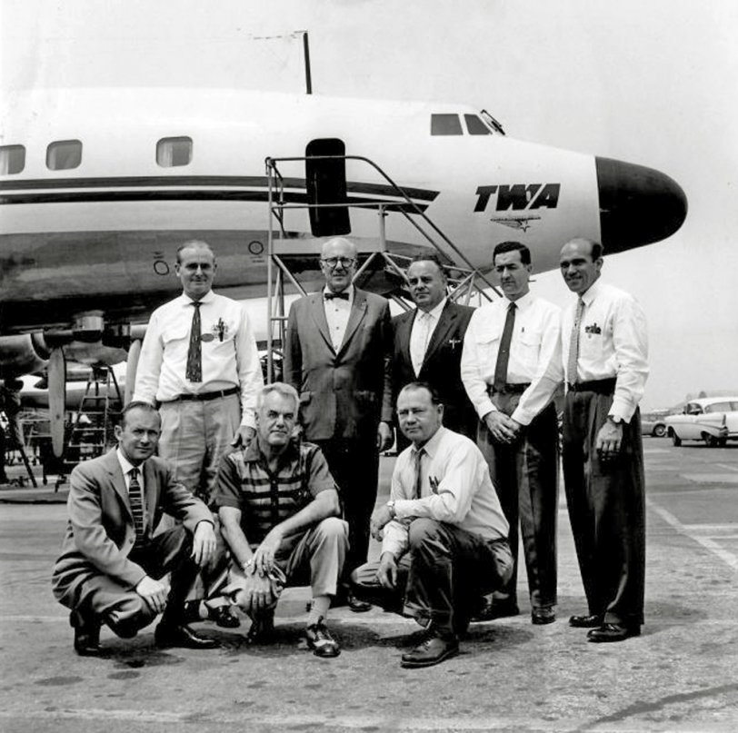 My grandfather, Warren Erickson, at the upper left with his pals and co-workers at the Lockheed factory in Burbank, California in May 1958.  These guys were with TWA, charged with getting this graceful beast working right. This was the model 1649, the Super Constellation, and the last version made. The first was the 049, dating back to WW2. TWA was the primary customer of this bird. It was a daunting and formidable job, indeed. They had the some of the most formidably complicated piston engines to maintain, the Wright R-3350 Duplex-Cyclones.
I was told how he loved his job and the guys he worked with. They were involved with one of the most beautiful planes ever made, working tirelessly to get the problems resolved. These were the days of slide rules, screwdrivers, and cocktail napkin drawings. View full size.
