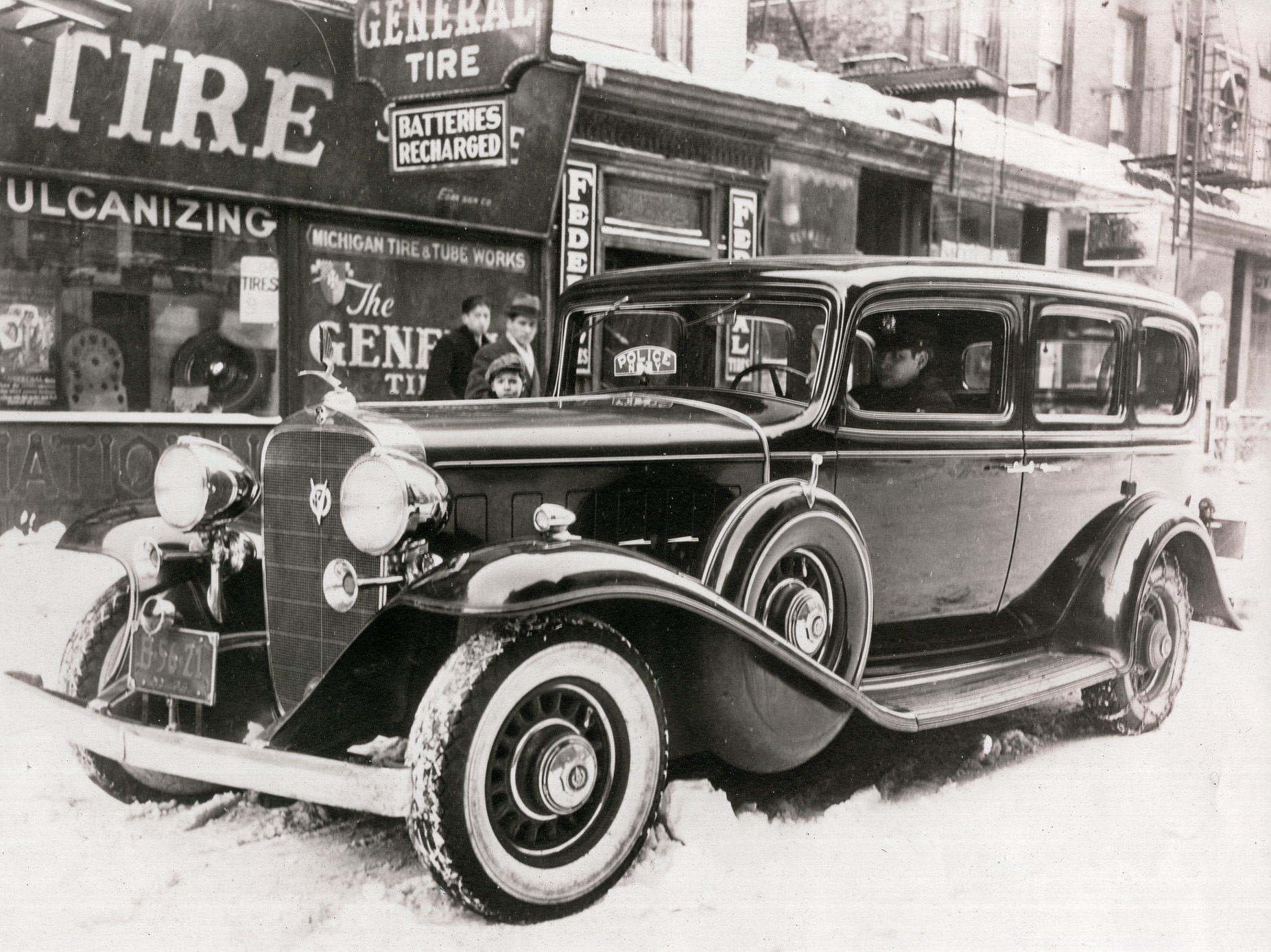 Back of photo has typed: "A-550-9, NEW YORK CITY- Police Commissioner's Car Showing Insignia. Received from New York March 1, 1934."

Below that are two rubber stamps: a blue one: "Warner Bros. Pictures Inc Burbank, Calif. Property of Research Department" which is crossed out, and above it a purple stamp: "Columbia Pictures Corporation Research Department." View full size.