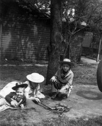 My sister, little cousin and I play cowboys in the yard on Washington Street, Freeport, Illinois, circa 1951. The house and trees are gone now. View full size.
(ShorpyBlog, Member Gallery)