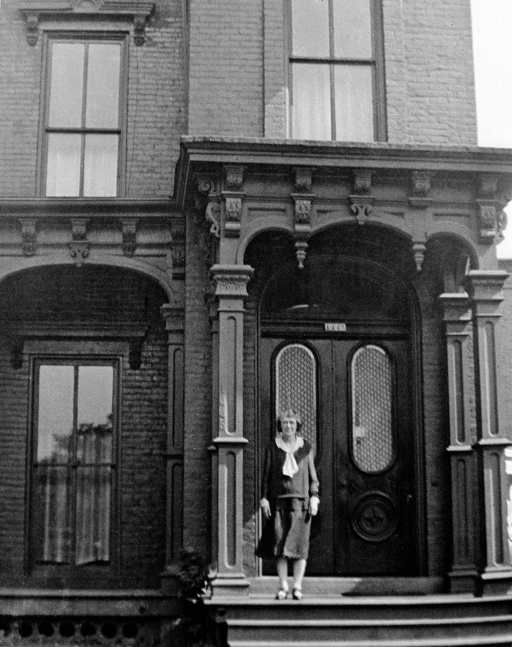 Great-Grandmother Margaret Mary Cox at her home at 1445 West Lafayette Street, Detroit. A fast food restaurant now occupies the site. Photo about 1935 by unknown photographer. Margaret Cox was born in 1880 in Beaver Falls, Pennsylvania. View full size.