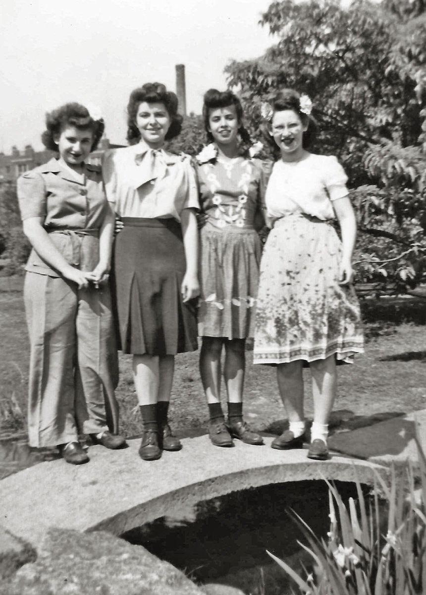 Cynthia, Arlene, Agnes, and Rosilyn is written on the margin of this photo showing my teenaged future mother (in the dark skirt) with three classmates, at some park or botanical garden in Brooklyn, New York near the end of World War II.