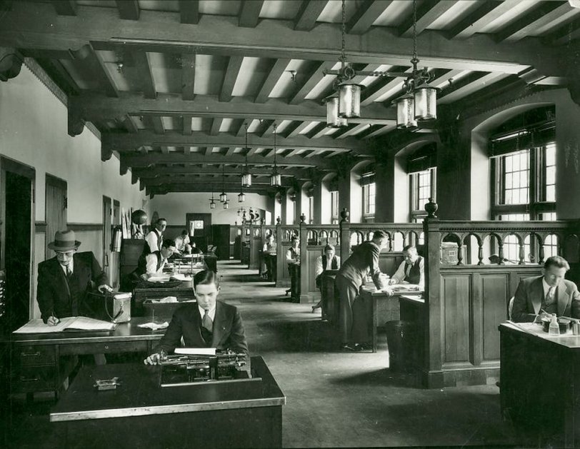 My dad emigrated from Scotland when he was 19. Shortly after he took a job with the Detroit News as a copy boy.  He is in the forefront at the typewriter in the news room, circa 1920s. View full size.
